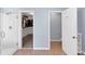 Bathroom featuring walk-in closet, tiled floor, walk-in shower, and toilet at 338 Santa Anita Ave, Woodstock, GA 30189