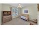 Cozy bedroom featuring a crib and ample natural light at 338 Santa Anita Ave, Woodstock, GA 30189