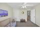 Spacious bedroom featuring a crib and neutral decor at 338 Santa Anita Ave, Woodstock, GA 30189