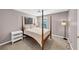 Comfortable bedroom with four-poster bed and neutral tones at 338 Santa Anita Ave, Woodstock, GA 30189