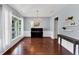 Elegant dining room featuring hardwood floors, chandelier, and large windows at 338 Santa Anita Ave, Woodstock, GA 30189