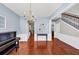 Bright dining room with hardwood floors, chandelier, and view into other rooms at 338 Santa Anita Ave, Woodstock, GA 30189