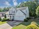 Two-story home with well-manicured lawn, two-car garage, and lovely front porch at 338 Santa Anita Ave, Woodstock, GA 30189