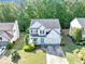 Aerial view of a two-story house with landscaped front yard and two car garage at 338 Santa Anita Ave, Woodstock, GA 30189