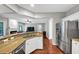 Large open kitchen with granite countertop, stainless steel appliances, and open concept to living room at 338 Santa Anita Ave, Woodstock, GA 30189
