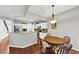 Bright, open kitchen flowing into the dining room and showcasing stainless steel appliances and granite counters at 338 Santa Anita Ave, Woodstock, GA 30189