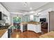 Bright open kitchen with granite countertops, stainless steel appliances, and hardwood floors at 338 Santa Anita Ave, Woodstock, GA 30189