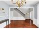 Open-concept living room with hardwood floors, staircase, and ample natural light at 338 Santa Anita Ave, Woodstock, GA 30189