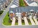 An aerial view of townhomes with manicured lawns, showcasing community layout at 3788 Chattahoochee Summit Se Dr # 22, Atlanta, GA 30339