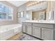 Bathroom with a bathtub and a vanity sink with cabinets at 3788 Chattahoochee Summit Se Dr # 22, Atlanta, GA 30339