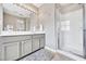 Bathroom featuring a walk-in shower and a vanity sink with cabinets at 3788 Chattahoochee Summit Se Dr # 22, Atlanta, GA 30339