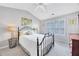 Comfortable bedroom with carpet, an iron bed frame and lots of natural light at 3788 Chattahoochee Summit Se Dr # 22, Atlanta, GA 30339