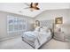 Serene bedroom with tray ceiling, plush carpet, a large window, and neutral color palette at 3788 Chattahoochee Summit Se Dr # 22, Atlanta, GA 30339