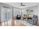 Stylish living room with modern furniture, plantation shutters, and hardwood floors at 3788 Chattahoochee Summit Se Dr # 22, Atlanta, GA 30339
