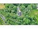 High angle aerial view of a modern home nestled in lush greenery at 507 Karen Ln, Woodstock, GA 30188