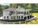 Expansive backyard featuring multiple decks, a covered patio, and a lush green yard at 507 Karen Ln, Woodstock, GA 30188