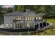Expansive backyard featuring multiple decks, a covered patio, and a lush green yard at 507 Karen Ln, Woodstock, GA 30188