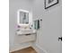 Modern powder room with a floating vanity, vessel sink, and illuminated mirror at 507 Karen Ln, Woodstock, GA 30188