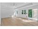 Spacious bedroom with hardwood floors and natural lighting coming from two windows at 507 Karen Ln, Woodstock, GA 30188