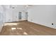 A spacious bedroom with hardwood flooring, three doors and natural light at 507 Karen Ln, Woodstock, GA 30188