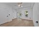 Bright bedroom features wood floors, a ceiling fan, and sliding glass doors to a private balcony at 507 Karen Ln, Woodstock, GA 30188