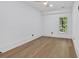 Bright bedroom with hardwood floors and a modern ceiling fan, bathed in natural light at 507 Karen Ln, Woodstock, GA 30188