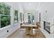 Elegant dining room with ample natural light, a fireplace, and seating for six at 507 Karen Ln, Woodstock, GA 30188