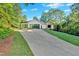 Beautiful house with a long driveway and well-manicured lawn at 507 Karen Ln, Woodstock, GA 30188