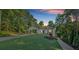 Charming one-story home featuring a side entry garage, stone accents, and lush landscaping at 507 Karen Ln, Woodstock, GA 30188