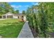 Charming one-story home featuring a side entry garage, stone accents, and a sidewalk at 507 Karen Ln, Woodstock, GA 30188
