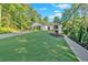Charming one-story home featuring a side entry garage, stone accents, and a sidewalk at 507 Karen Ln, Woodstock, GA 30188