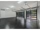 A spacious garage with modern glass-panel doors and a sleek, polished floor at 507 Karen Ln, Woodstock, GA 30188
