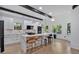 Bright kitchen features a large island with marble countertops, pendant lighting, and stainless steel appliances at 507 Karen Ln, Woodstock, GA 30188