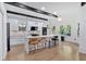 Bright kitchen features a large island with marble countertops, pendant lighting, and stainless steel appliances at 507 Karen Ln, Woodstock, GA 30188