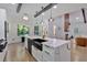 The kitchen island features a marble countertop with brass hardware and an undermount sink at 507 Karen Ln, Woodstock, GA 30188