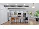 Modern kitchen featuring a large island, white cabinetry, stainless steel appliances, and stylish barstools at 507 Karen Ln, Woodstock, GA 30188