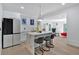 Beautiful kitchen with stainless steel appliances, marble countertops, and an eat-in island with seating at 507 Karen Ln, Woodstock, GA 30188