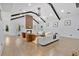 Spacious living room showcasing vaulted ceilings with wooden beams, fireplace, and hardwood floors at 507 Karen Ln, Woodstock, GA 30188