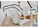 Vaulted living room featuring wood beams, modern decor, and an open layout to the kitchen at 507 Karen Ln, Woodstock, GA 30188