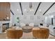 Bright living room featuring vaulted ceilings, wood beams, a fireplace, and modern furnishings at 507 Karen Ln, Woodstock, GA 30188