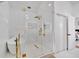 Bathroom featuring a glass-enclosed shower, a soaking tub, and gold hardware at 507 Karen Ln, Woodstock, GA 30188
