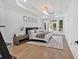Bright main bedroom featuring hardwood floors, recessed lights, and a decorative rug at 507 Karen Ln, Woodstock, GA 30188