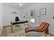 Bright office features a contemporary desk, stylish chaise lounge, and abundant natural light at 507 Karen Ln, Woodstock, GA 30188