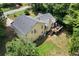 Aerial view showcasing the home's backyard, deck, roof, and surrounding trees at 83 Andrew Jackson Ct, Dallas, GA 30157