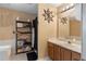 Well-lit bathroom with decorative shelving, framed mirrors, and modern fixtures at 83 Andrew Jackson Ct, Dallas, GA 30157