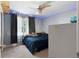 Comfortable bedroom with a bed, ceiling fan, and neutral carpet at 83 Andrew Jackson Ct, Dallas, GA 30157