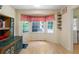 Breakfast nook with bright bay window, storage cabinets, and light-colored walls and flooring at 83 Andrew Jackson Ct, Dallas, GA 30157