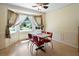 Dining area features a bay window with natural light, light-colored walls, and a Coca-Cola-themed table set at 83 Andrew Jackson Ct, Dallas, GA 30157