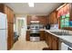 Functional kitchen with stainless steel appliances, wood cabinets, and a bright, airy atmosphere at 83 Andrew Jackson Ct, Dallas, GA 30157