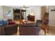 Inviting living room with a stone fireplace, hardwood floors, and comfortable seating, perfect for relaxation at 83 Andrew Jackson Ct, Dallas, GA 30157